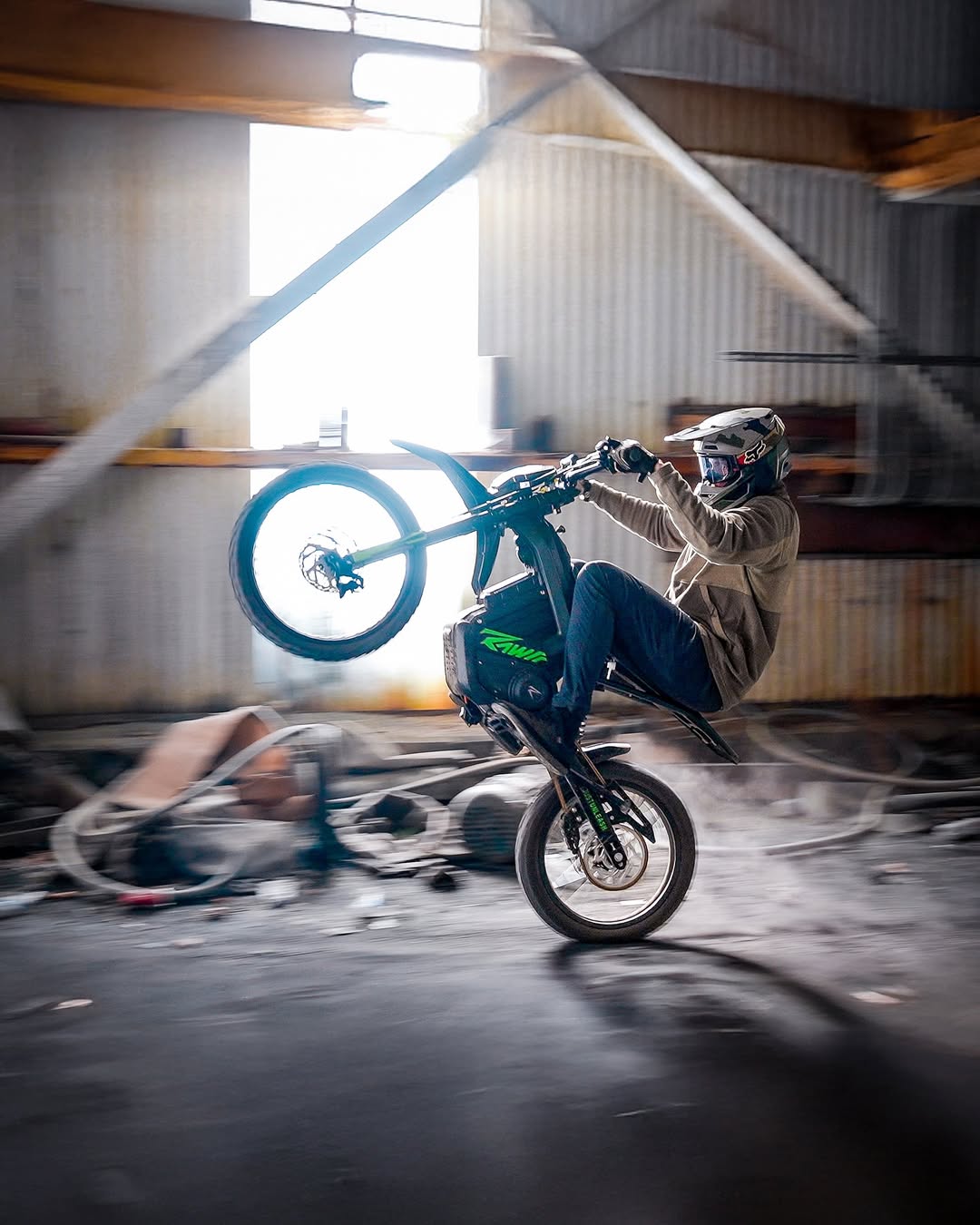 A rider heads up with a rawrr mantis x model inside a work building.