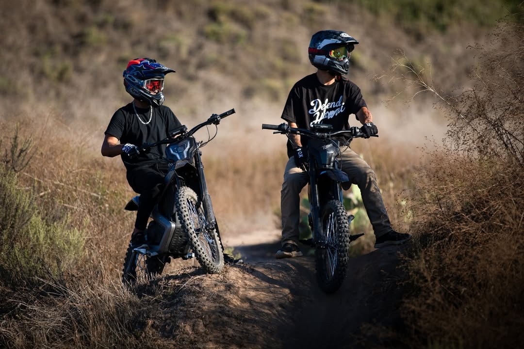 Two young people are riding the rawrr mantis.