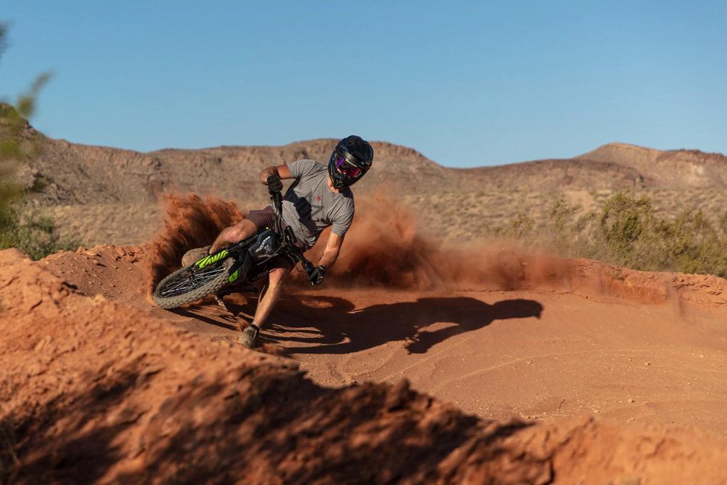 Guy rides Mantis X model on sand trail